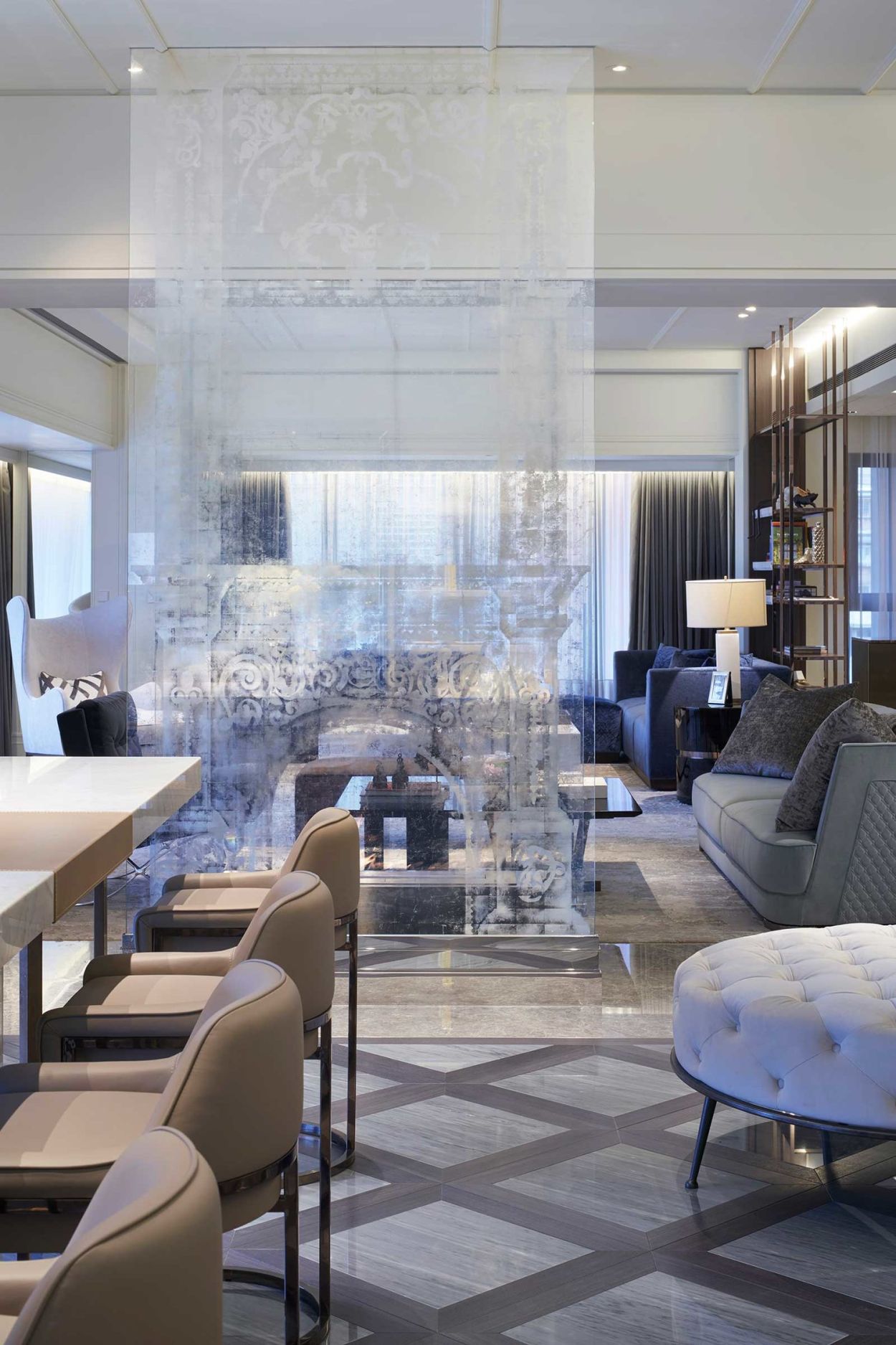 Silver translucent verre églomisé fireplace.