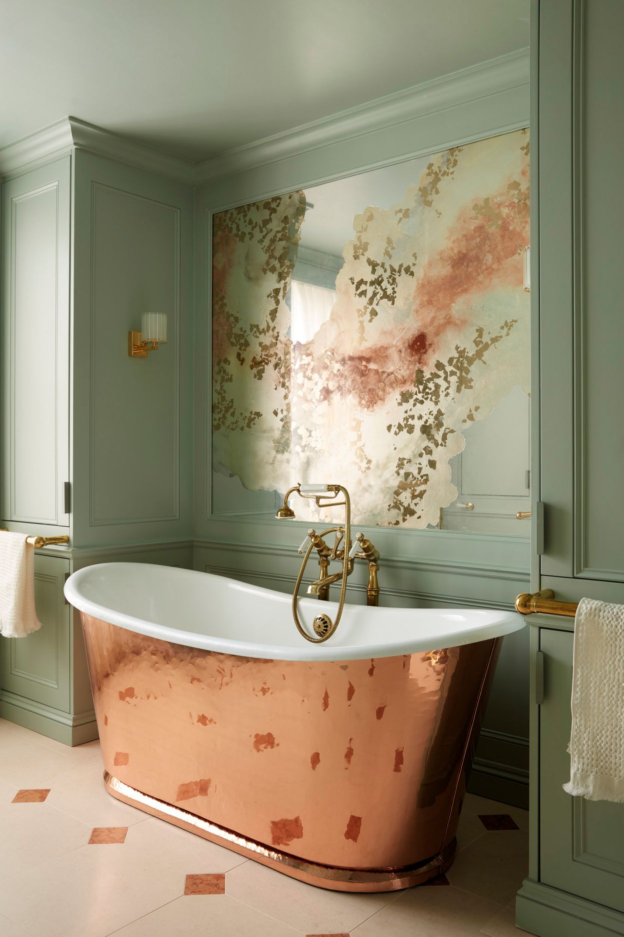 Verre églomisé feature artwork in bathroom with copper bath by Drummonds.