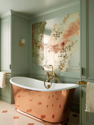 Verre églomisé feature artwork in bathroom with copper bath by Drummonds.