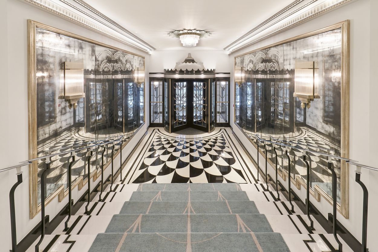Verre églomisé installation either side of the Art Deco stairs at Claridge's, London.
