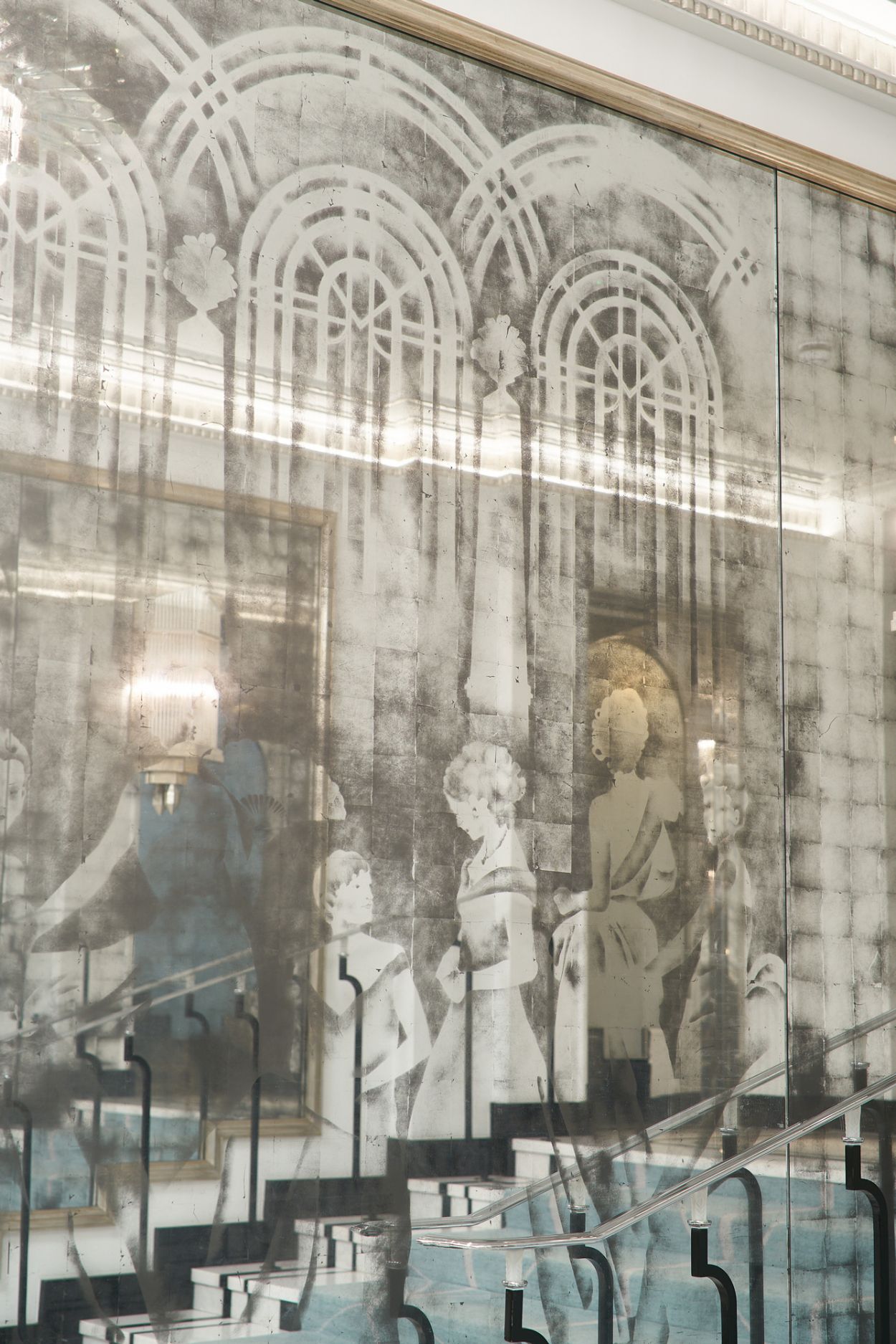 Verre églomisé installation along the Art Deco stairs at Claridge's, London.