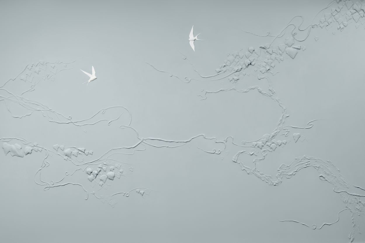 White swallows sculpted in bas relief plaster by Peascod.