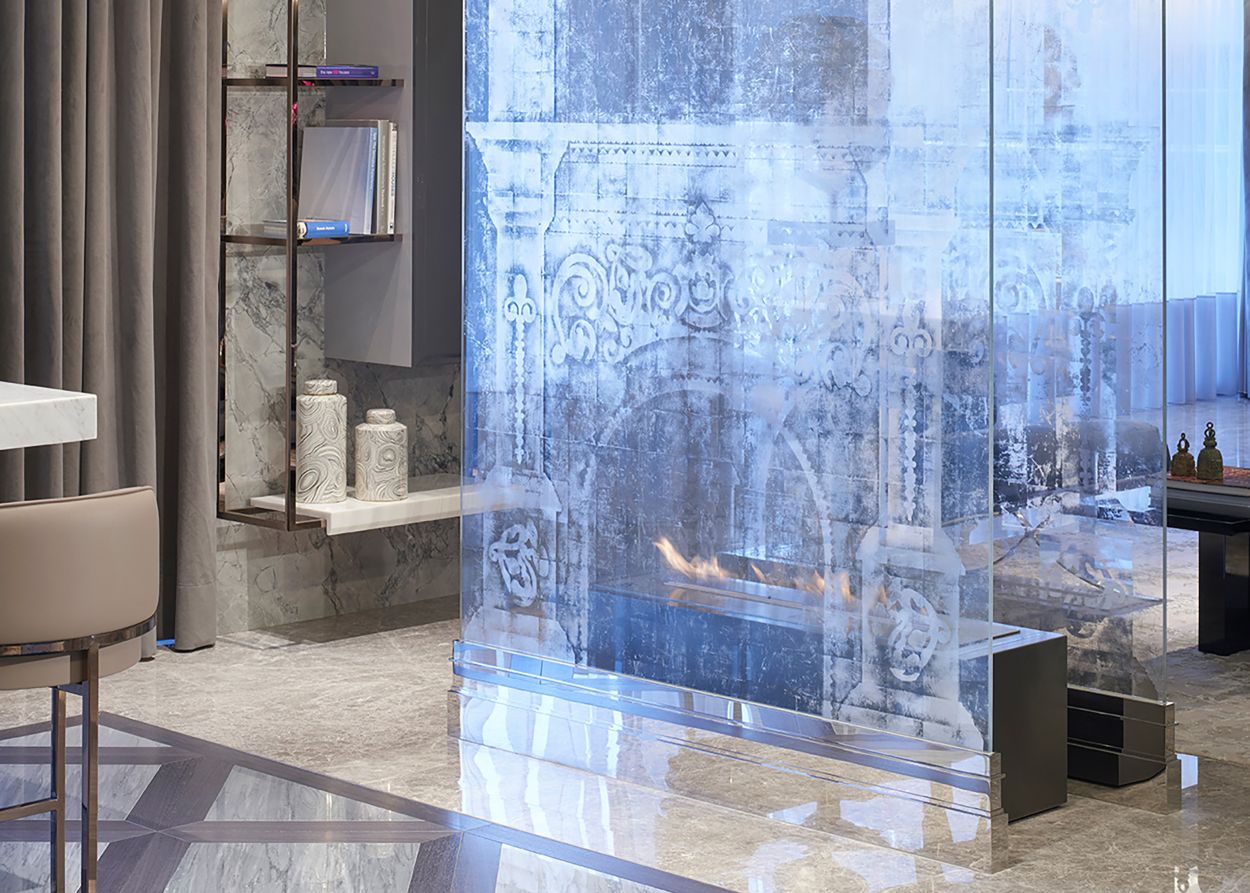 Apartment with translucent verre églomisé fireplace.