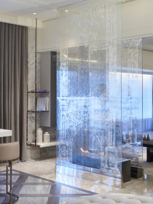 Penthouse apartment with translucent verre églomisé fireplace.