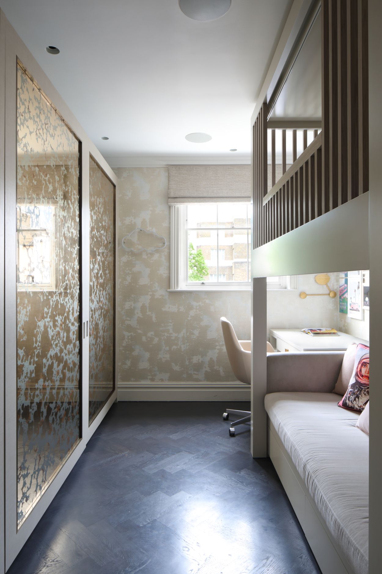 Bronze and gold verre églomisé wardrobe doors in London interior.
