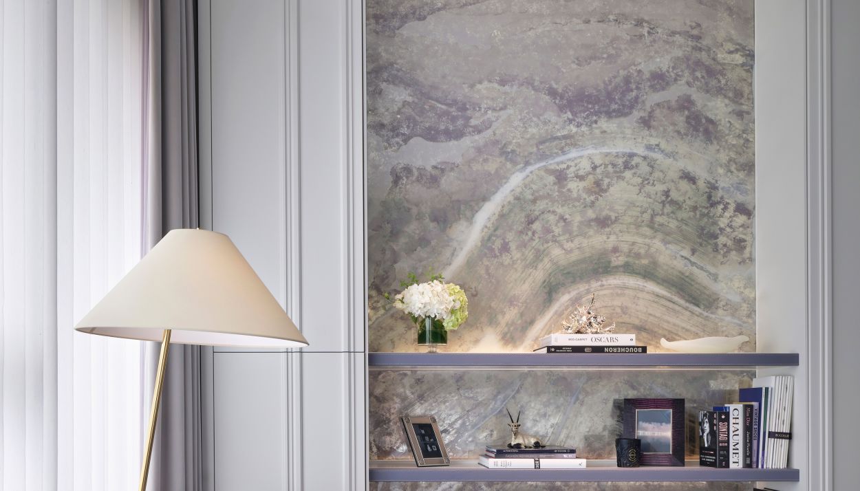 Verre eglomise artwork in bedroom niche.