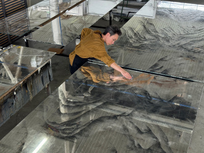 Emma gilding huge mountain scape in for restaurant.