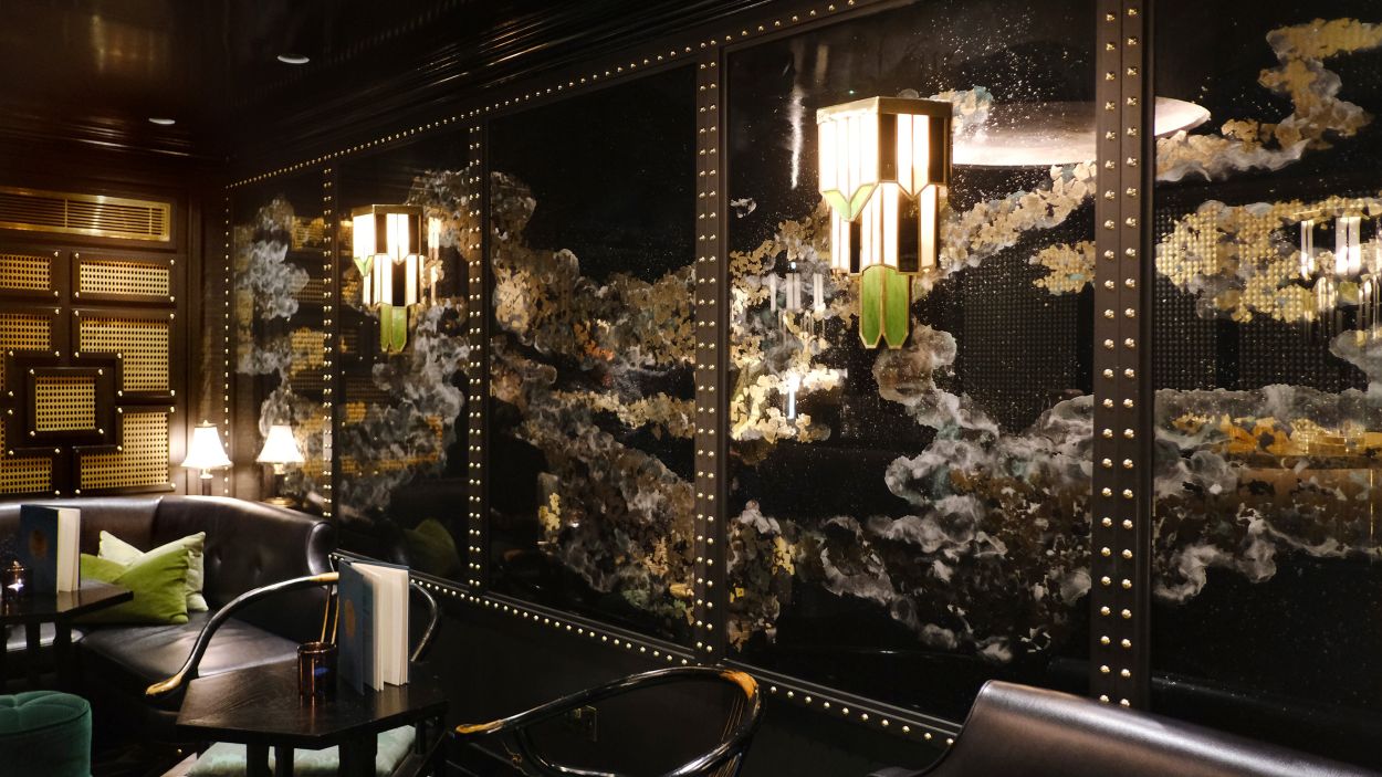 MiMi Mei Fair 24 ct gold and black verre églomisé feature installation.